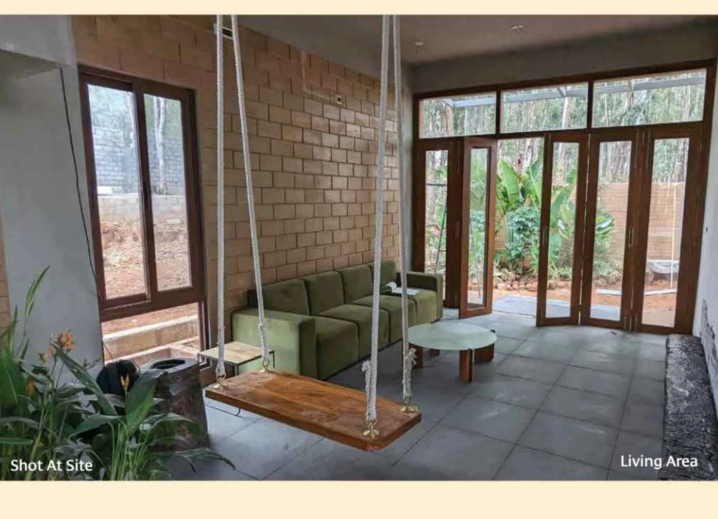 Gravity Smera Gardens living area opening to the private backyard garden Gravity Smera Gardens living area opening to the private backyard garden